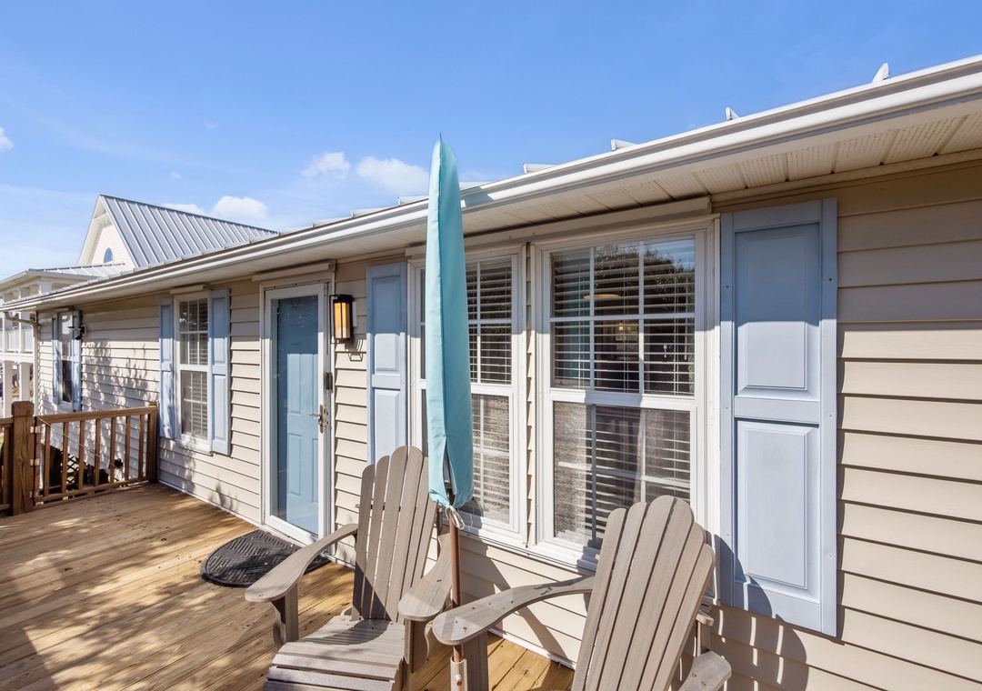 Relax on your private deck with Adirondack chairs and beach umbrella, perfect for morning coffee or evening unwind.