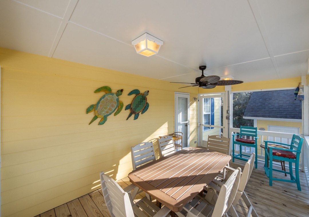 Dine under tropical turtle art on your private deck, where coastal breezes and cheerful colors create the perfect spot for memorable meals.