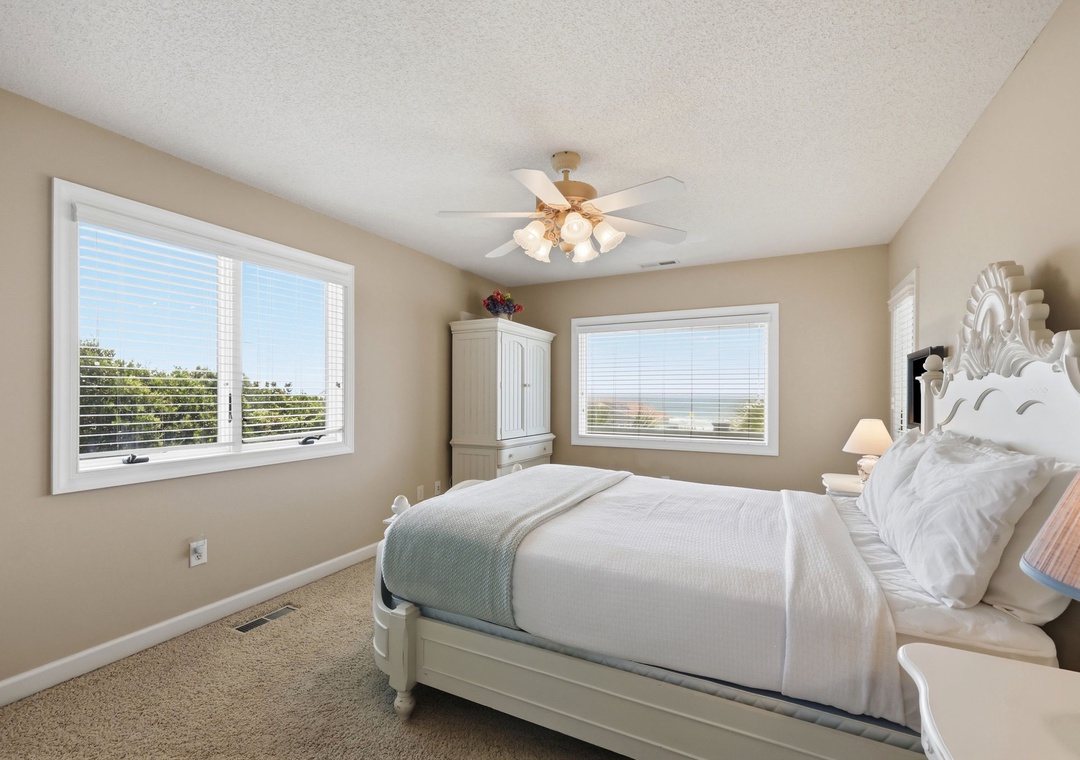 Drift off in a serene bedroom where soft coastal tones and gentle sunlight create your personal sanctuary. Elegant furnishings and crisp linens invite your most restful nights.