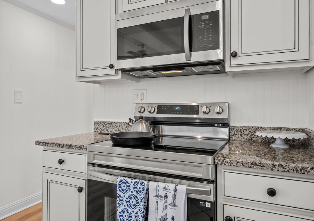 Cook with ease in your fully-equipped kitchen, featuring granite counters, stainless steel appliances, and all the cookware you need.