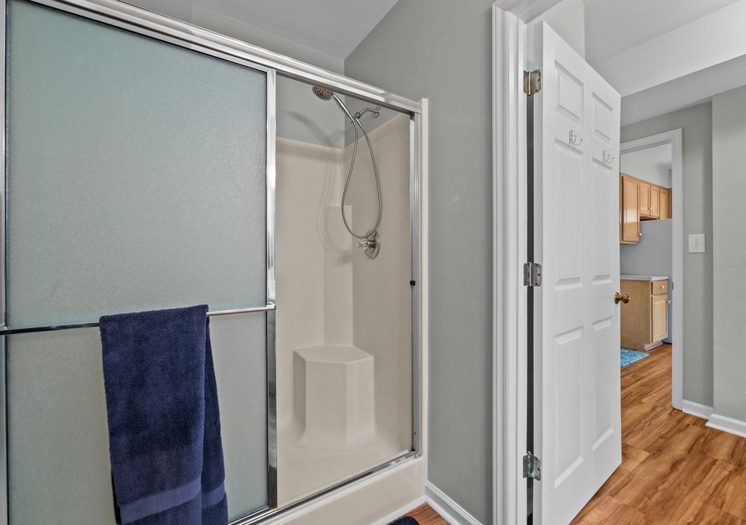 Ground Floor: Step into your bright, modern bathroom with a refreshing walk-in shower and built-in seating for ultimate comfort and relaxation.