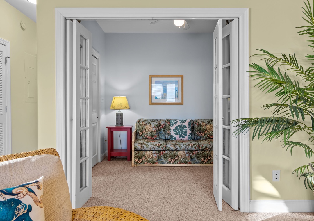Step into your peaceful retreat where tropical touches and cozy seating create the perfect spot to unwind after exploring.