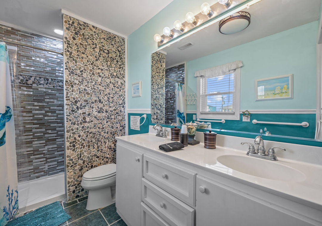 Refresh in your coastal-inspired bathroom with stone accent tiles, dual vanities, and spa-like details that make your morning routine feel luxurious.