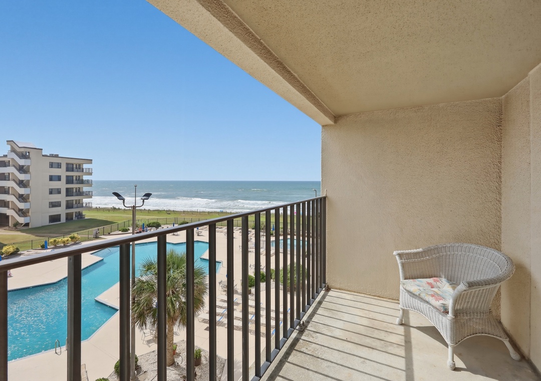 Relax on your private balcony overlooking the pool and sparkling ocean. Feel the coastal breeze as you unwind with stunning water views just steps from your door.