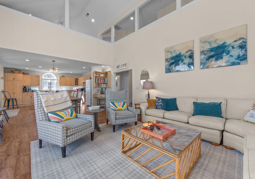 Relax in your bright, airy living space featuring soaring ceilings and cozy seating where you'll unwind after exploring.