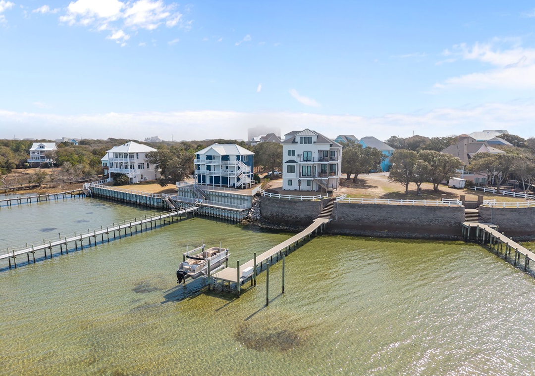 Stunning waterfront property with private pier and dock access in a charming coastal community.