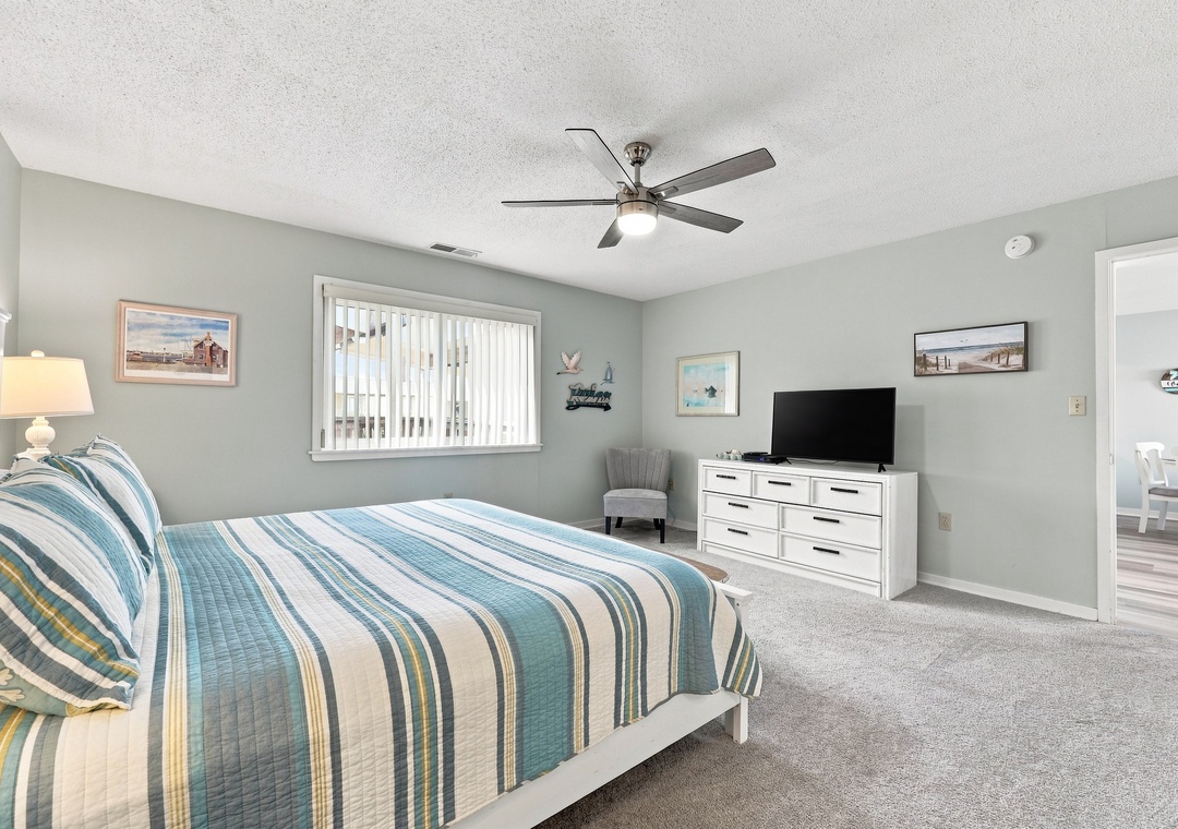 Char’s Cozy Condo | King Bedroom and Television