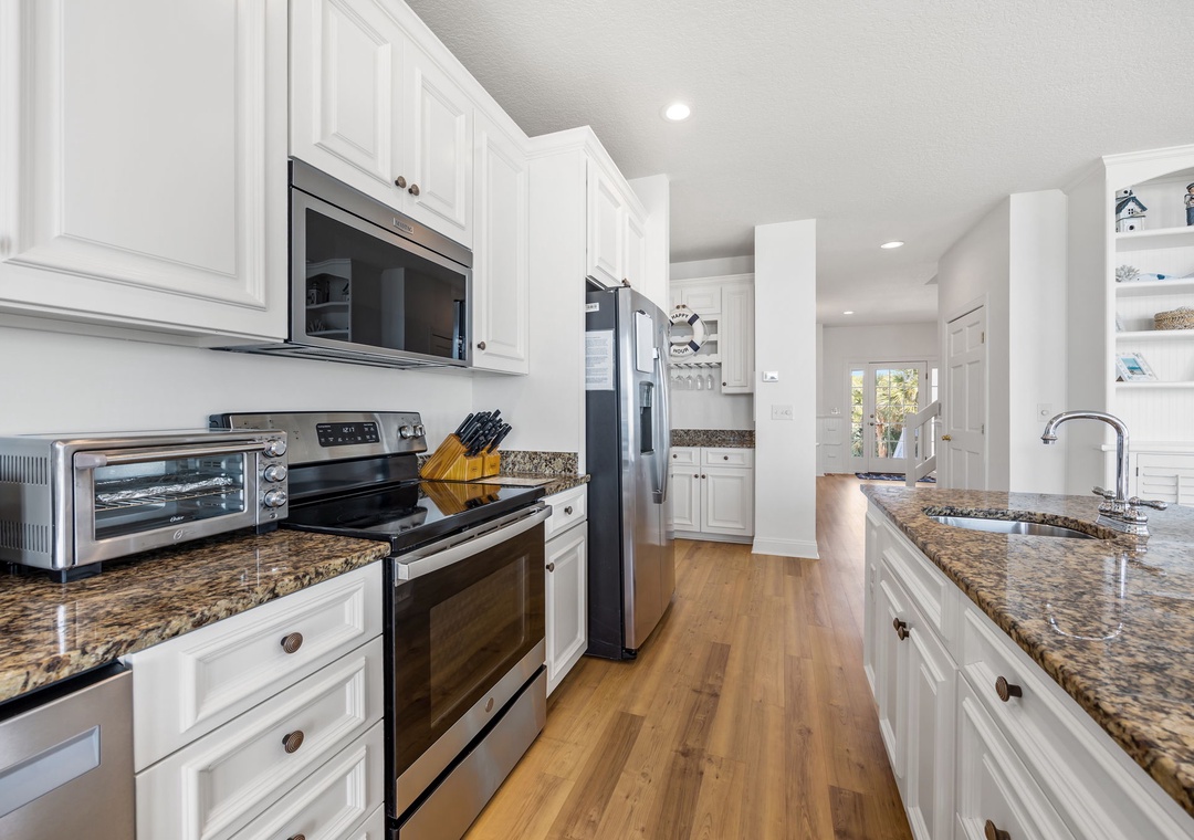 Your fully equipped kitchen features granite countertops, stainless steel appliances, and all the essentials for preparing memorable meals during your stay.