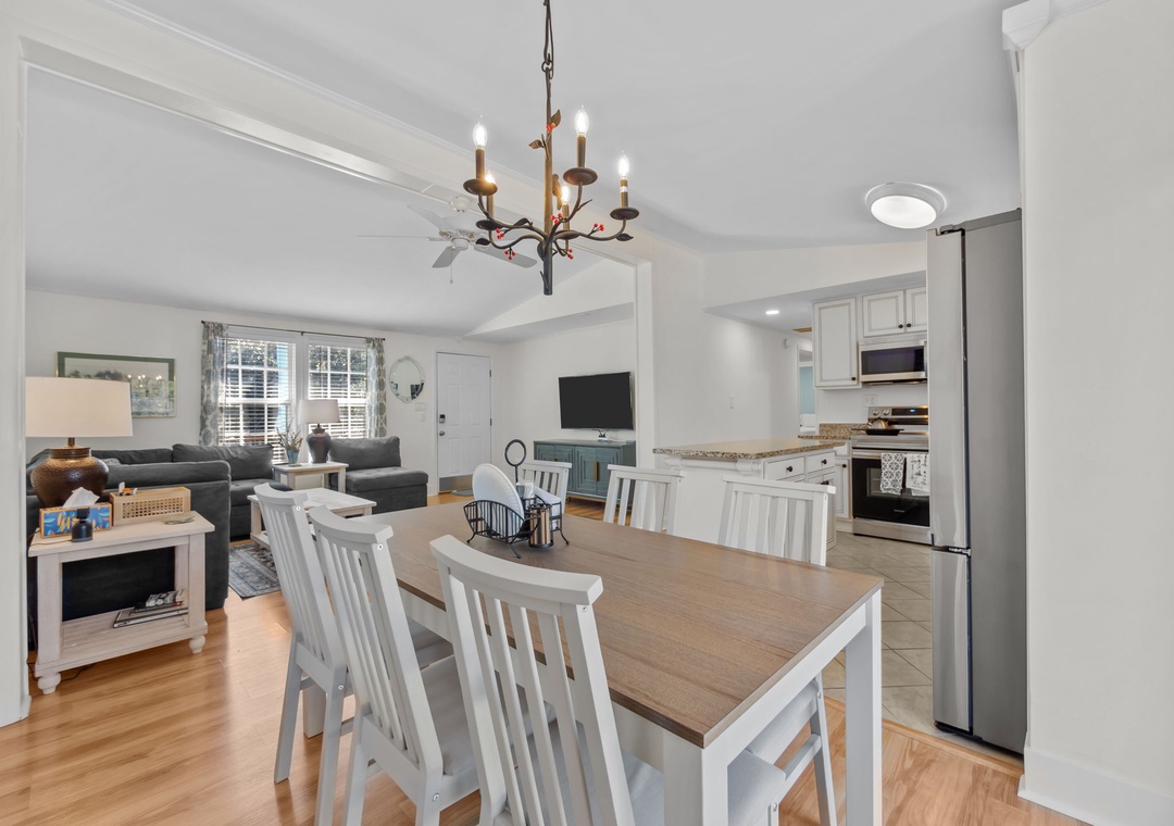 Your open-concept retreat seamlessly blends modern comfort with coastal charm, featuring a fully equipped kitchen and cozy living area perfect for gathering.