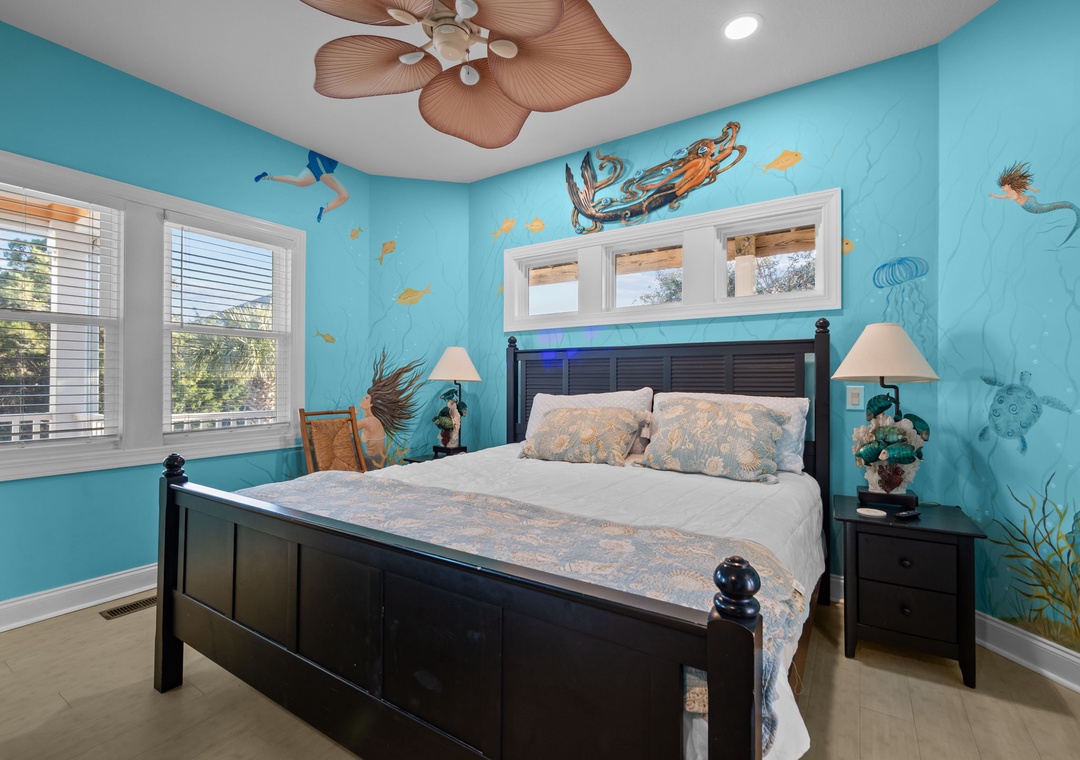 Drift off to sleep in this ocean-themed bedroom where sea life murals and tropical breezes create your personal underwater paradise.