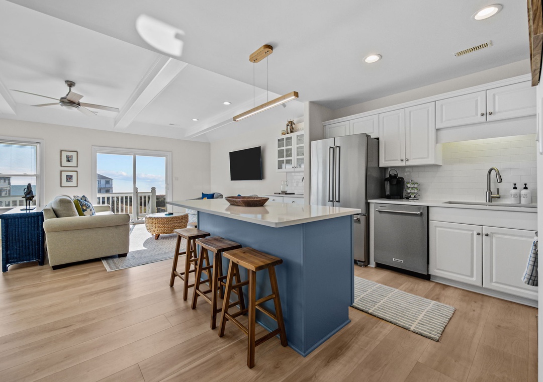 Your bright open-plan kitchen flows seamlessly into the living space, perfect for vacation cooking and relaxing together.