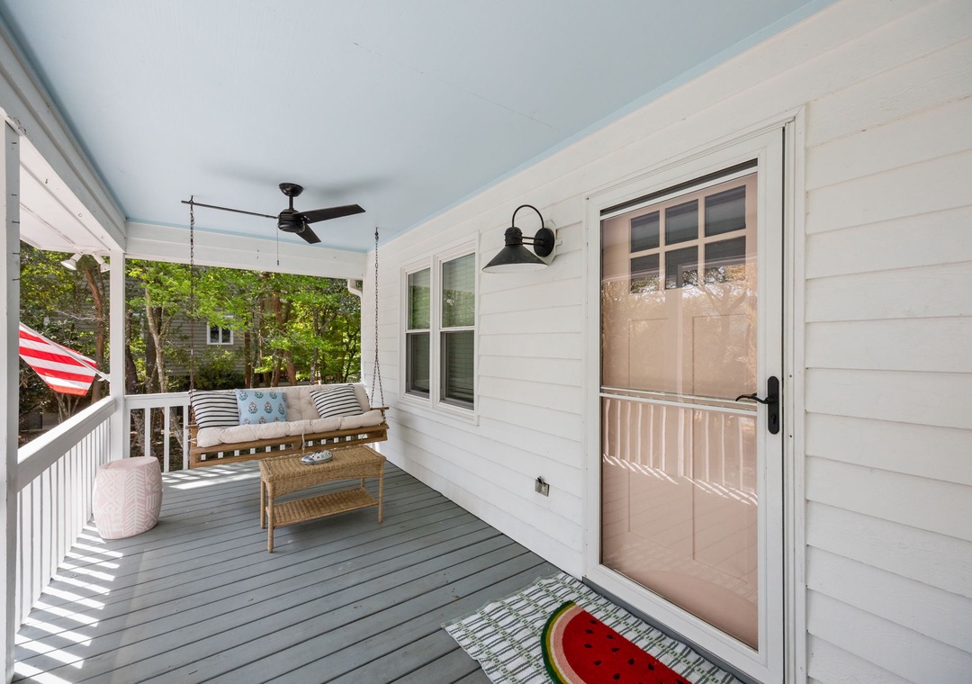 Relax on your charming covered porch with comfortable swing seating and gentle ceiling fan breezes.