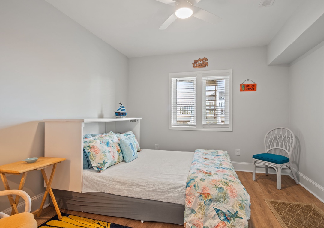 Your cozy bedroom features ocean-inspired linens and coastal charm, perfect for peaceful nights after beach days.