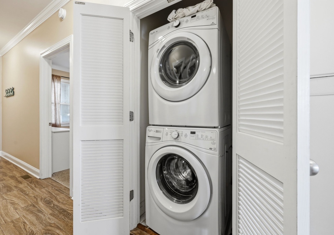 Your laundry needs are covered with this convenient stacked washer and dryer, tucked neatly behind louvered doors to keep your vacation space tidy and stress-free.