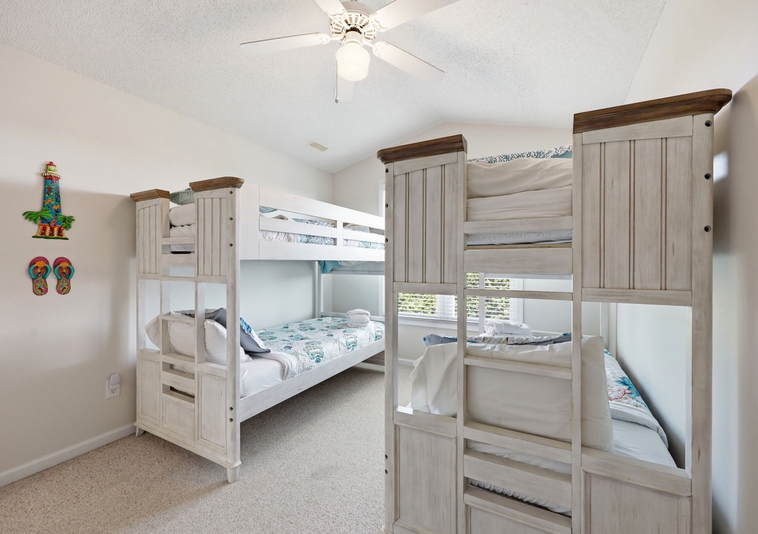 Your kids will love this cozy bunk room with two comfortable twin beds and playful beach-themed décor. A ceiling fan keeps the space cool and inviting after a fun-filled day.