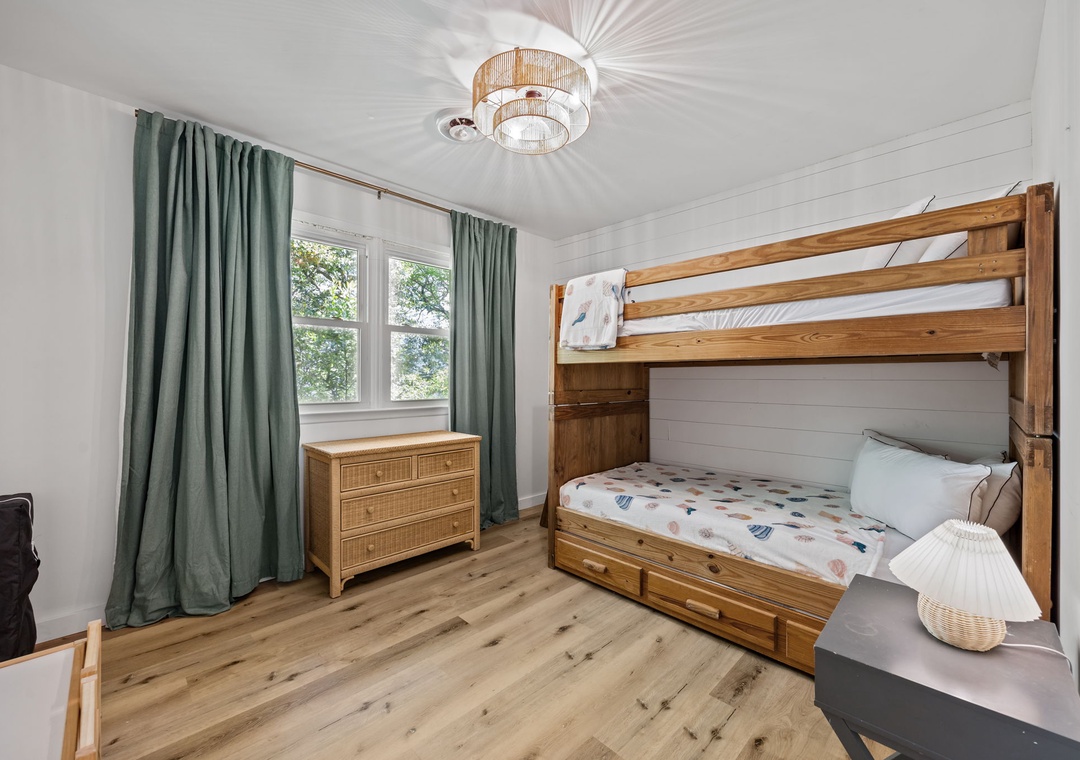 Your kids will love this cheerful bedroom with sturdy wooden bunk beds and plenty of natural light.