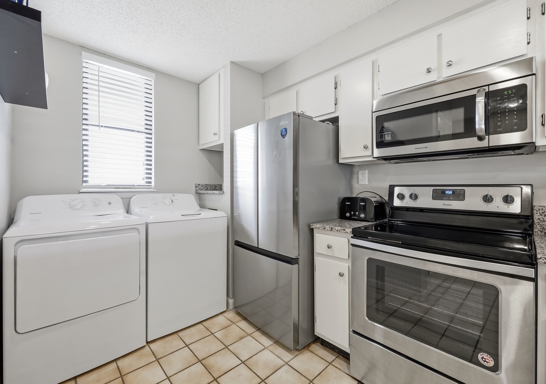 Your kitchen includes full-size modern appliances—fridge, stove, microwave—and in-unit washer and dryer, so you can pack light and cook comfortably during your stay.