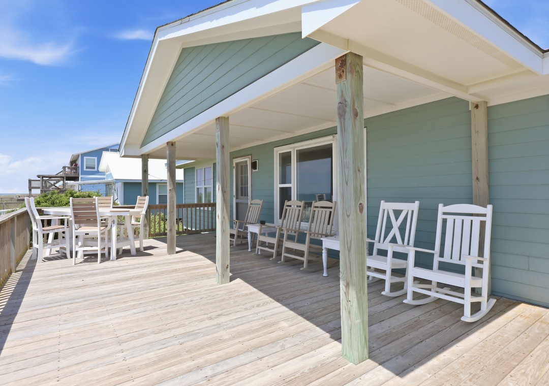 Your spacious covered deck welcomes you with plenty of seating for relaxing and dining outdoors, all with easy ocean access just steps away.