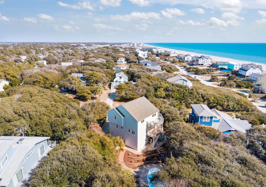 Elevated coastal home nestled among native vegetation, just minutes from pristine beaches and turquoise waters.