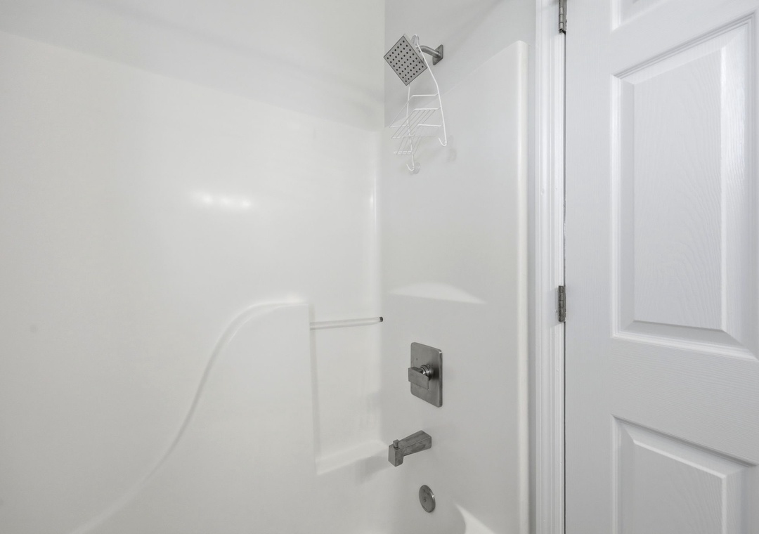 Your private bathroom features a spotless tub-shower combo with modern fixtures, freshly cleaned and ready for your stay.