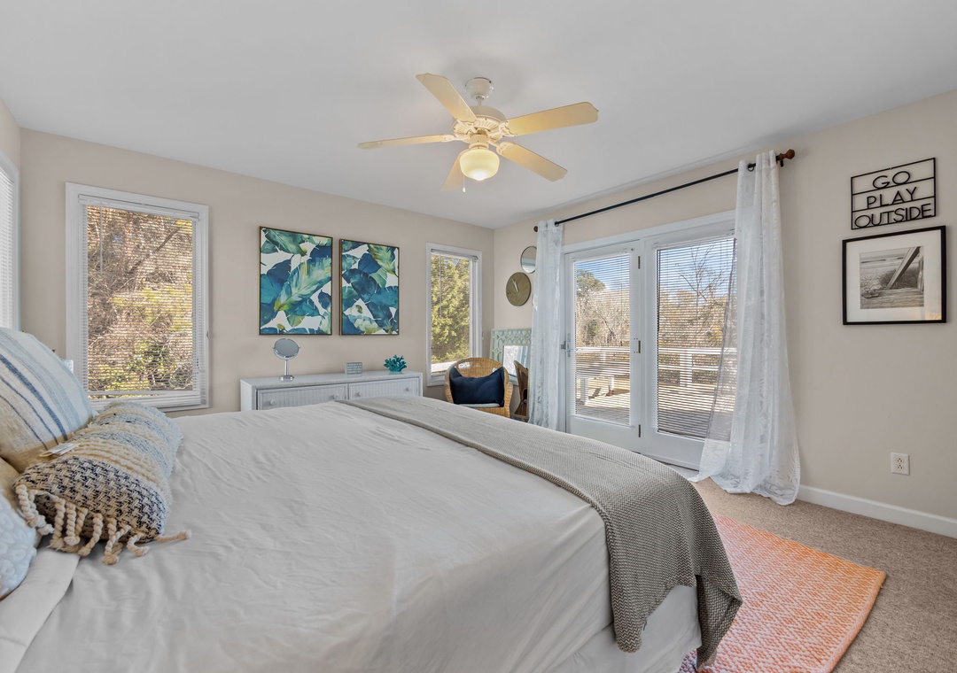 Wake up in your bright bedroom with natural light streaming through French doors leading to your private balcony.