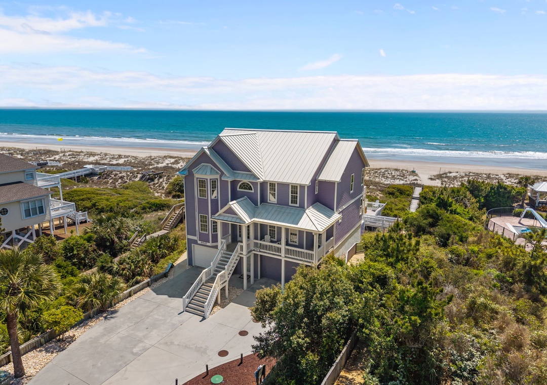 This stunning beach house sits perfectly positioned between ocean and dunes, offering direct beach access and breathtaking coastal views from every angle.