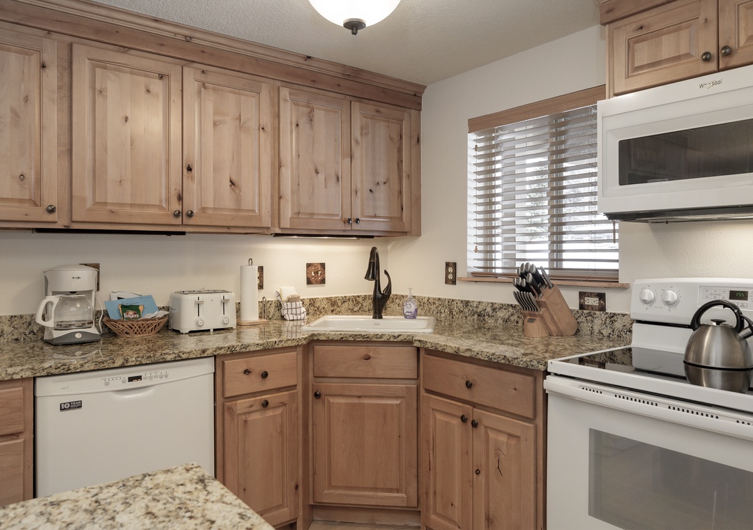 Your fully equipped kitchen features granite countertops, warm wood cabinets, and all the appliances you need to create memorable meals during your stay.