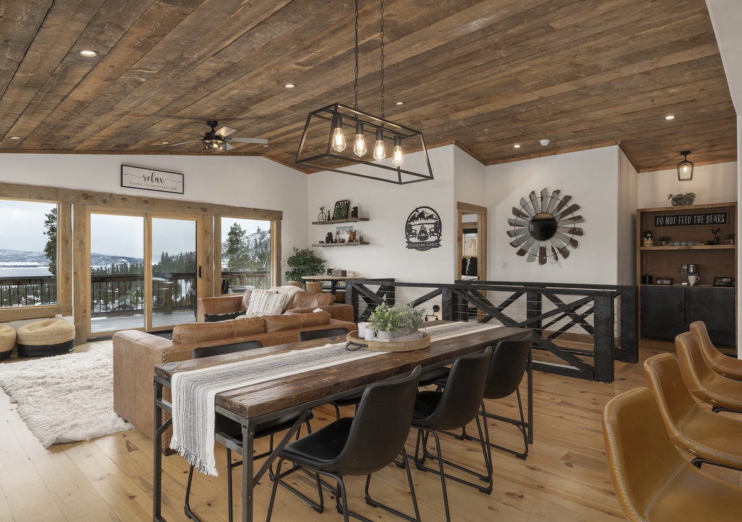 Gather around this stunning dining table at 224 GCR 4034 where rustic wood meets modern elegance, perfect for memorable meals with mountain views.