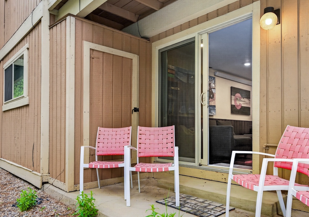 Unwind in your private outdoor space, furnished with comfy woven seating where you can sip morning coffee or enjoy the fresh air anytime.