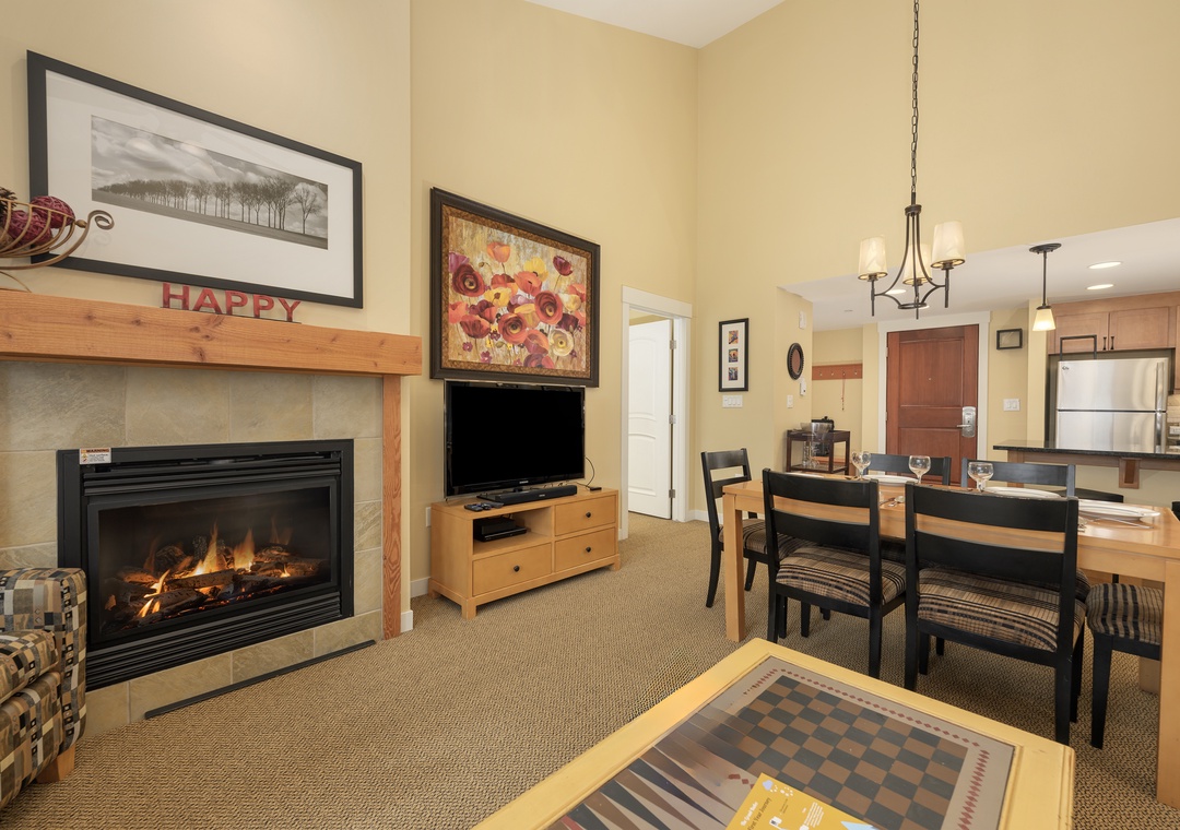 Cozy up by your crackling fireplace while enjoying meals at your dining table, with a full kitchen ready for your culinary adventures.