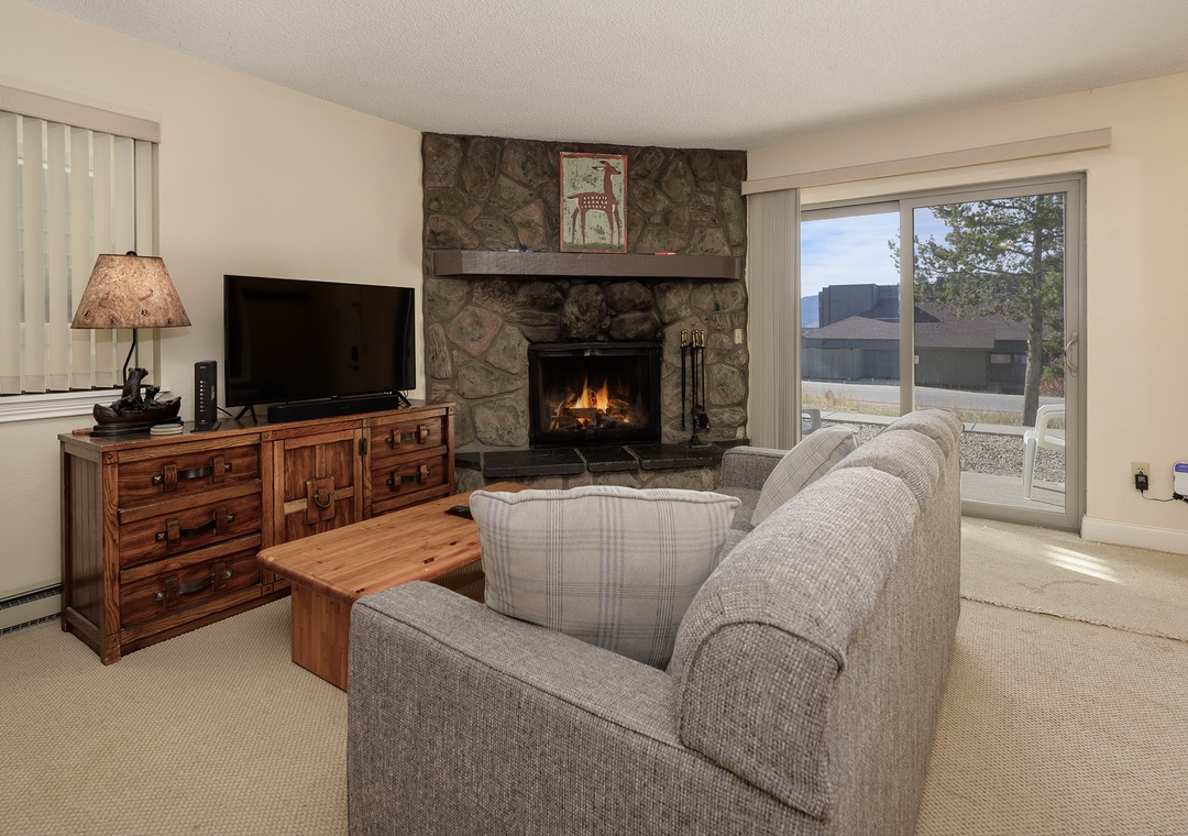 Cozy up in your living room with a crackling stone fireplace and comfortable seating for perfect mountain evenings.