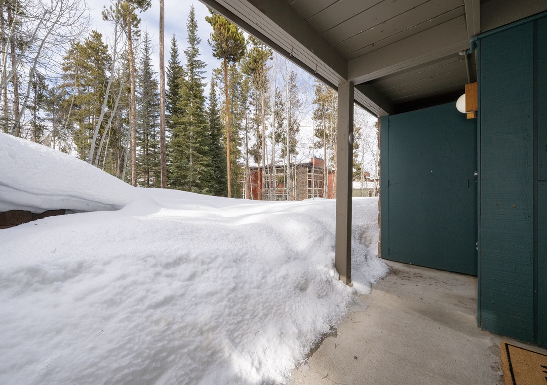 Step into your private winter sanctuary with heated floors and forest views beyond your covered patio.