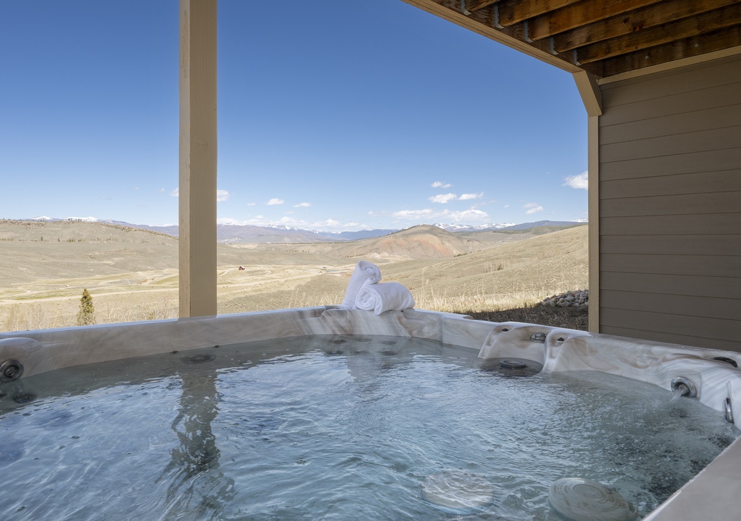 Soak in your private hot tub while gazing at endless mountain vistas and rolling hills stretching to the horizon.