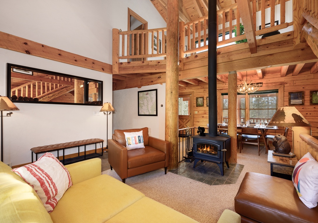 Cozy up in your rustic living room with exposed beams, crackling fireplace, and leather seating perfect for mountain evenings.