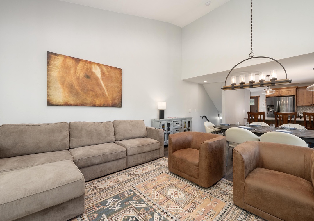 Sink into plush seating where modern comfort meets rustic charm, perfect for unwinding after your adventures.
