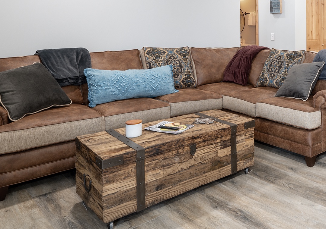 Sink into this cozy sectional with plush cushions and stylish pillows. Your perfect spot to unwind with coffee and magazines.