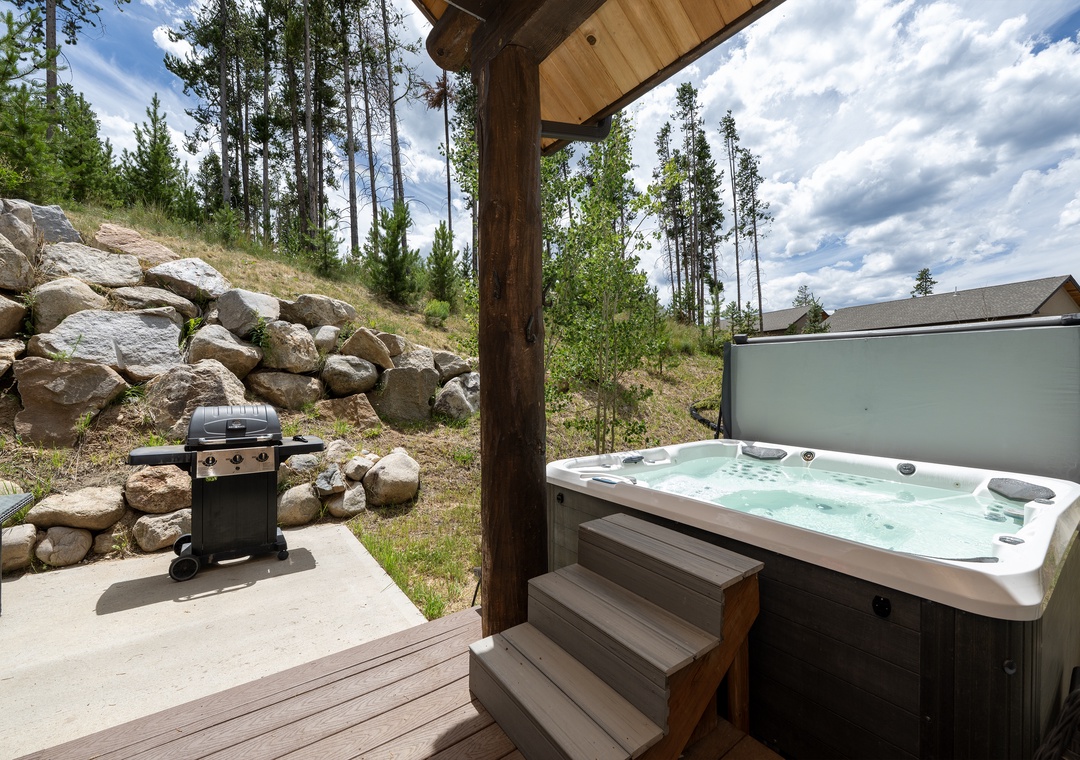 Soak in your private hot tub while gazing at towering pines and mountain vistas, then fire up the BBQ for an alpine dining experience.