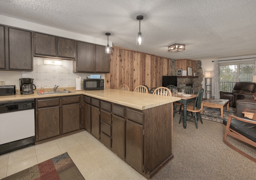 Your spacious open-concept kitchen flows seamlessly into the cozy living area, perfect for gathering with loved ones over home-cooked meals.