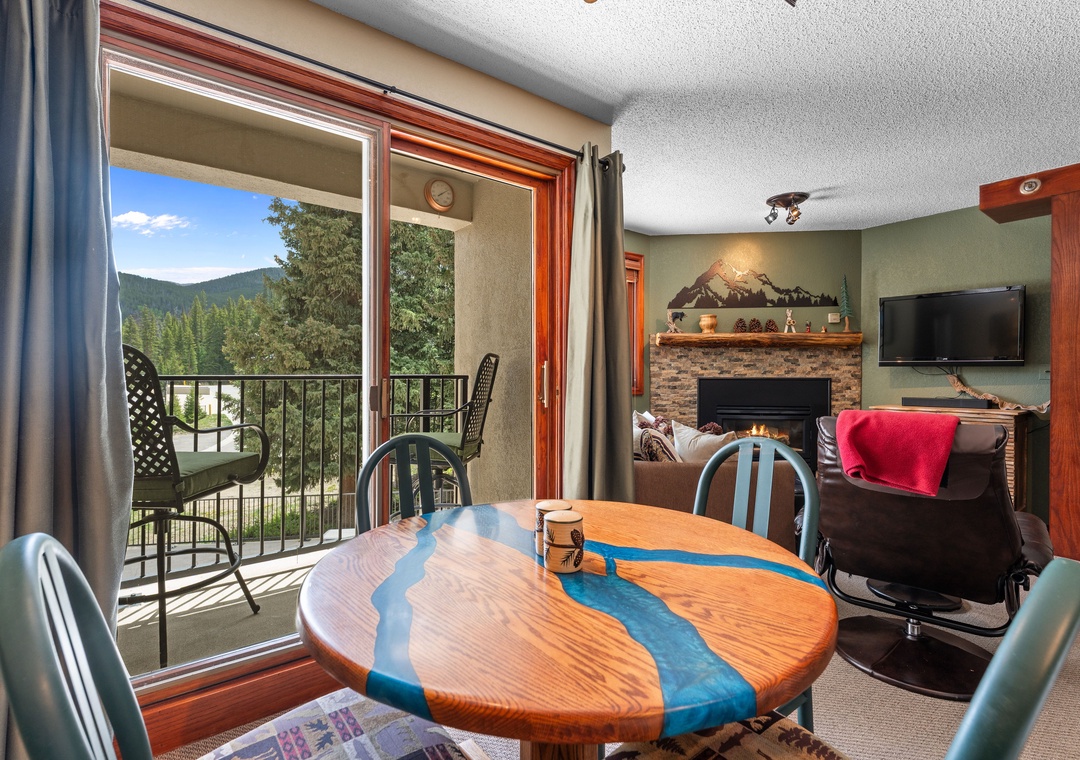 Unwind in your cozy space with mountain views from the balcony, a warm fireplace, and a unique artisan dining table that brings character to your stay.