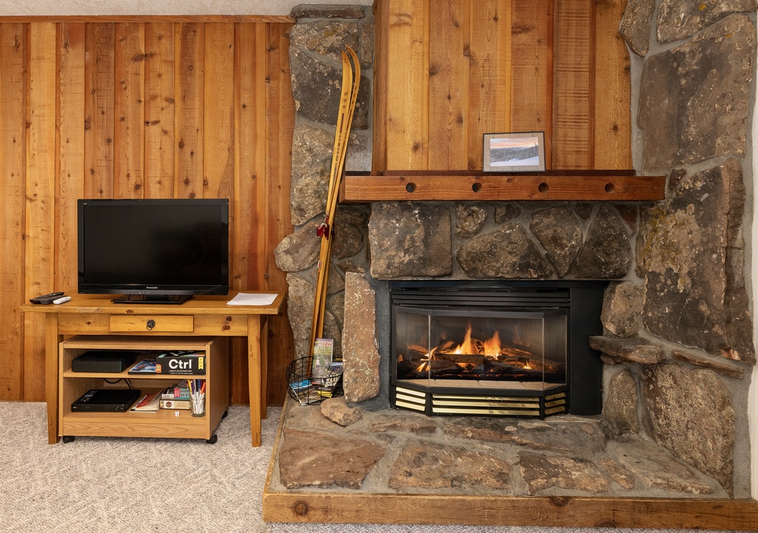 Cozy up beside your crackling stone fireplace while catching up on shows or unwinding with a good book.