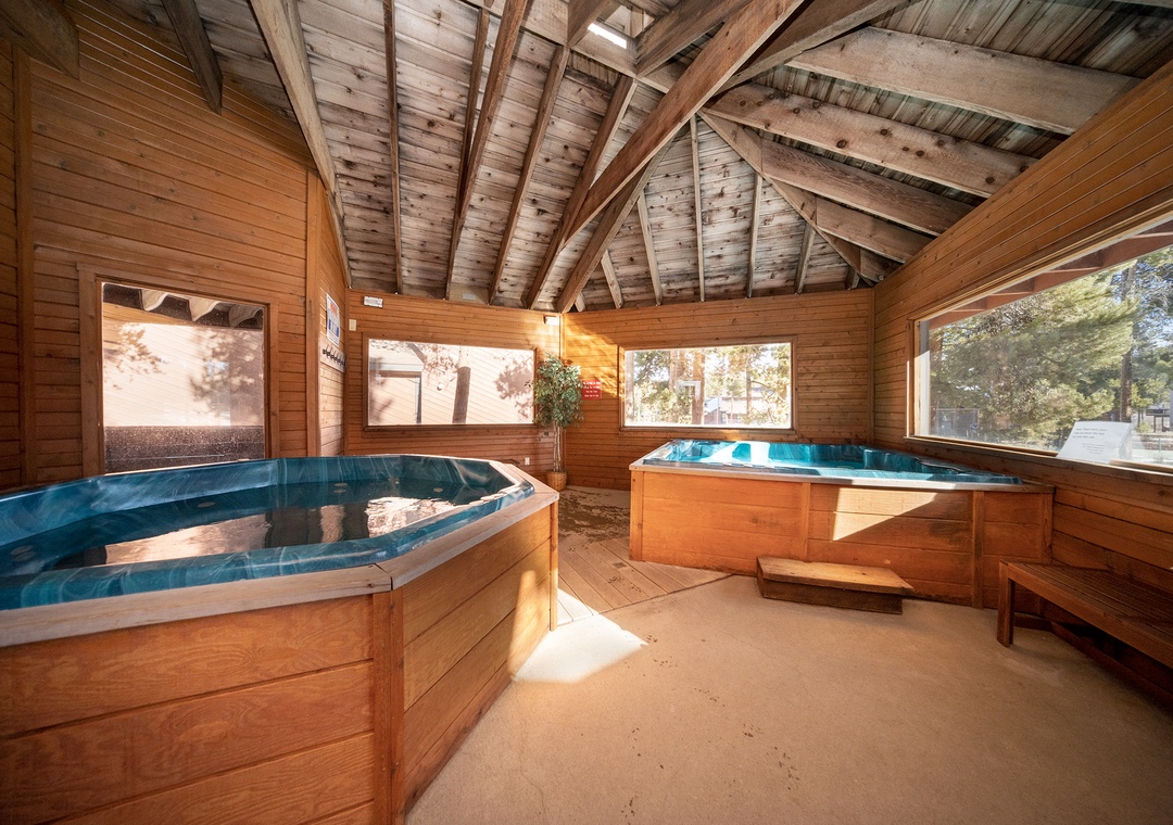 Soak your stress away in your private cedar hot tub sanctuary, where warm wood surrounds you with rustic charm.