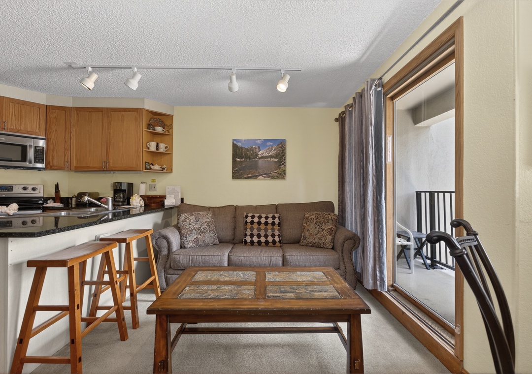 Relax in your cozy living space with a fully equipped kitchen at your fingertips and your own private balcony just steps away, perfect for morning coffee or evening unwinding.