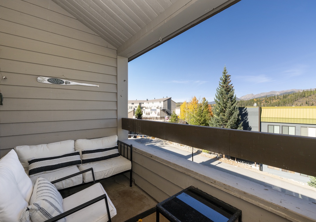 Unwind on your private mountain-view balcony with cozy seating, where autumn colors and crisp air create the perfect backdrop for morning coffee.