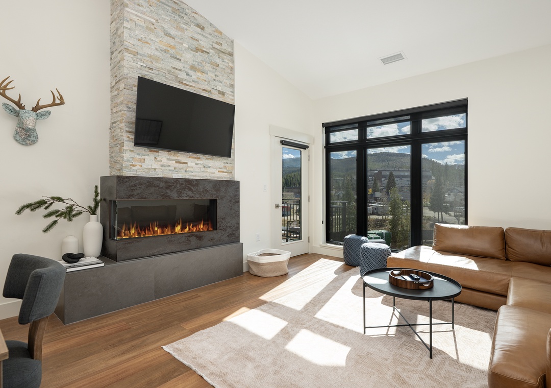 Sink into luxurious leather seating by your modern fireplace while mountain views frame your perfect retreat.