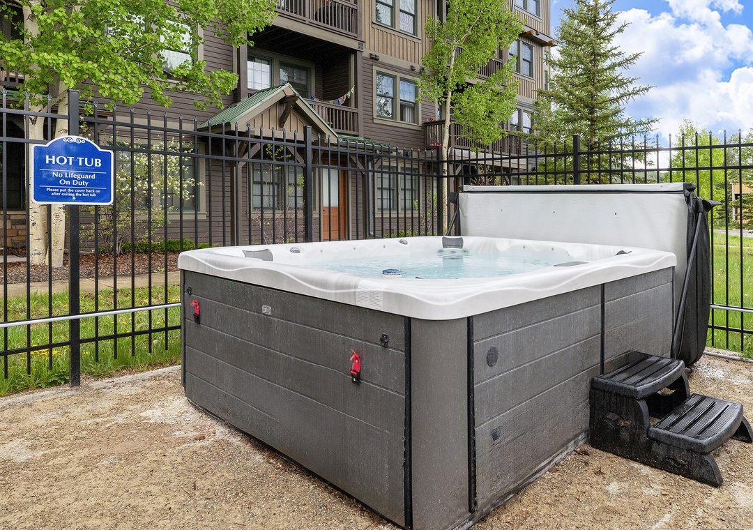 Soak your cares away in the bubbling hot tub, nestled among towering evergreens with crisp mountain air and sunny skies above.