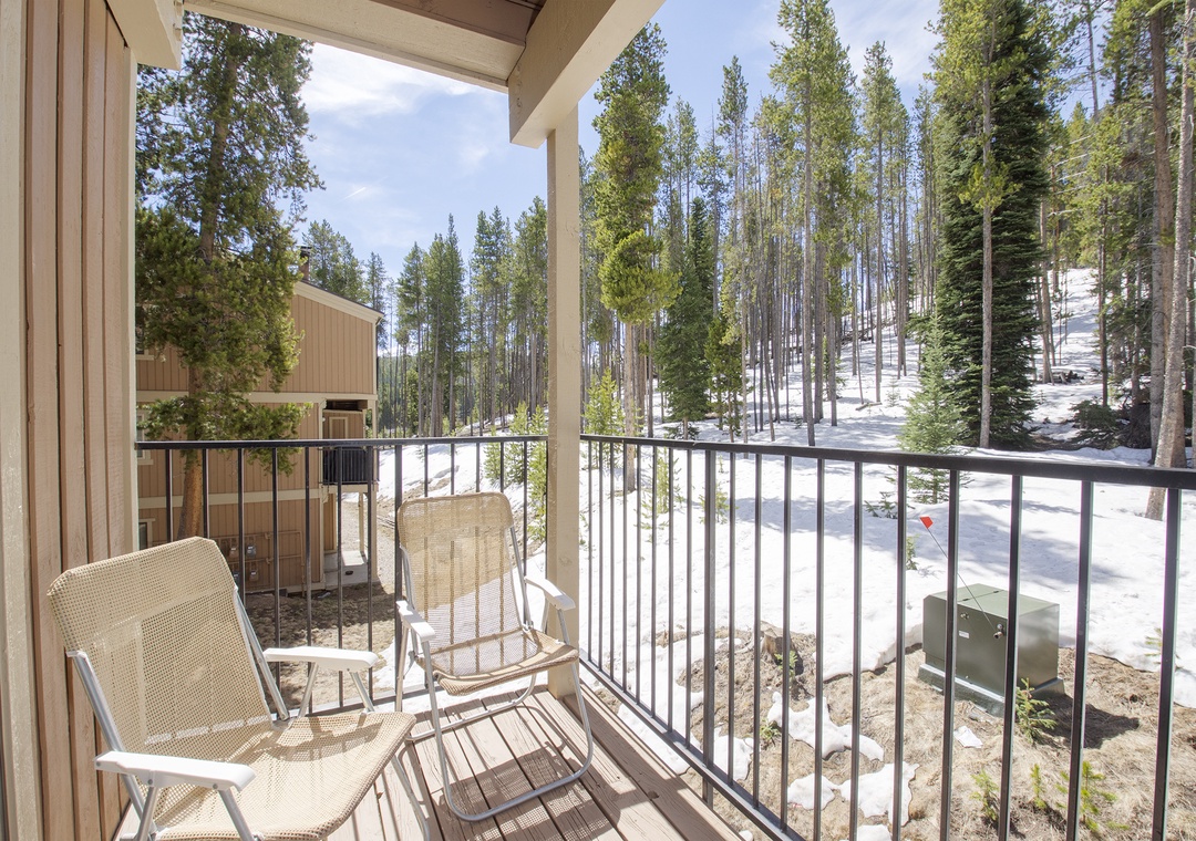 Step onto your private balcony and breathe in fresh mountain air surrounded by towering evergreens and snow-dusted slopes.
