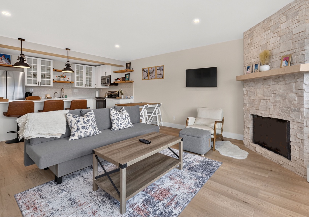 Unwind on the plush sofa enjoy streaming your favorite shows or sipping coffee in this bright, open living space designed with your comfort in mind.