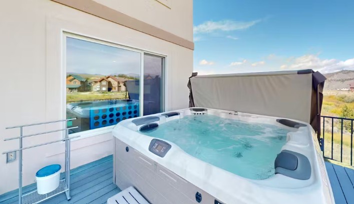 Your private hot tub overlooks serene hillside views—perfect for unwinding after a day of exploring. Feel the stress melt away as you soak under open skies.