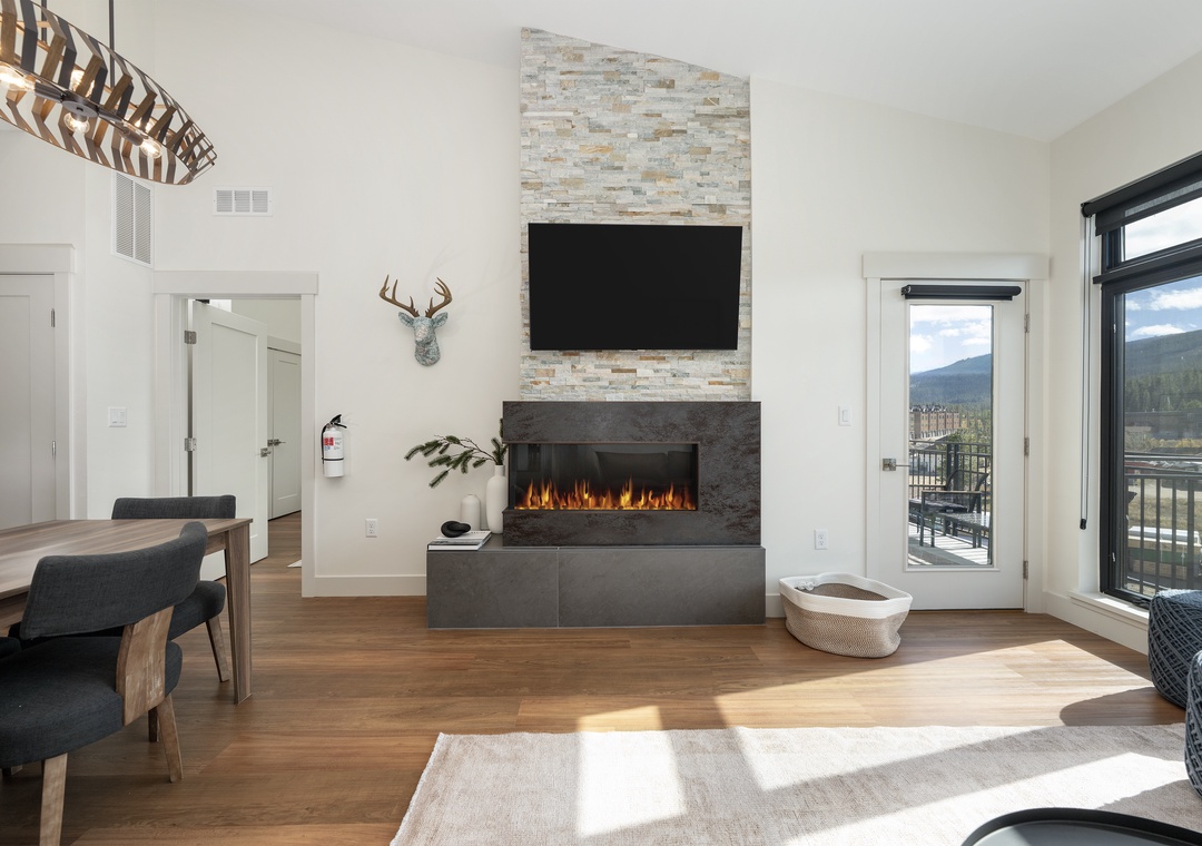 Unwind in this modern living space where your cozy fireplace and mountain views create the perfect retreat.