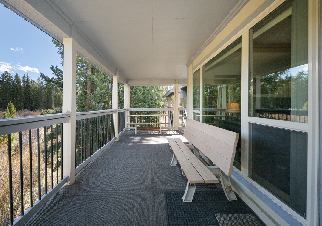 Step out onto your private covered balcony and breathe in the fresh mountain air while enjoying forest views from your comfortable outdoor seating.